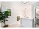 Upper landing area featuring a window, modern lighting fixture, and access to a bathroom at 76 Mayson Avenue Northeast Ne, Atlanta, GA 30307
