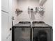 Modern laundry room with front-loading washer and dryer and convenient shelving at 76 Mayson Avenue Northeast Ne, Atlanta, GA 30307