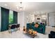 Open-concept layout connecting the living area, dining space, and kitchen with stainless appliances at 76 Mayson Avenue Northeast Ne, Atlanta, GA 30307