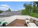 Private outdoor deck with lounge seating and wooded views at 76 Mayson Avenue Northeast Ne, Atlanta, GA 30307
