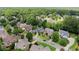 Aerial view showcasing homes in a well-established neighborhood with lush landscaping at 956 Kinghorn Nw Dr, Kennesaw, GA 30152