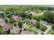 Overhead view showcasing the community's well-manicured lawns, landscaping, and residential streets at 956 Kinghorn Nw Dr, Kennesaw, GA 30152