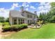 Large backyard with a patio area perfect for outdoor dining and entertaining at 956 Kinghorn Nw Dr, Kennesaw, GA 30152