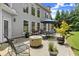 Spacious backyard features a patio with outdoor dining, fire pit and lush landscaping at 956 Kinghorn Nw Dr, Kennesaw, GA 30152
