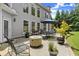 Backyard featuring a concrete patio, outdoor dining, landscaping, and lush green lawn at 956 Kinghorn Nw Dr, Kennesaw, GA 30152