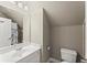 Bathroom with a white sink vanity, neutral paint, and ceramic tile floors at 956 Kinghorn Nw Dr, Kennesaw, GA 30152