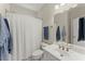 Clean bathroom featuring a single sink, ample lighting, and a shower and tub combo at 956 Kinghorn Nw Dr, Kennesaw, GA 30152