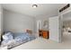 Bedroom featuring a single bed and a view into an additional room at 956 Kinghorn Nw Dr, Kennesaw, GA 30152