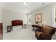 Simple bedroom with neutral walls, carpet, and a reading nook with natural light at 956 Kinghorn Nw Dr, Kennesaw, GA 30152