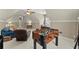 Bonus room featuring a foosball table and comfortable seating area at 956 Kinghorn Nw Dr, Kennesaw, GA 30152