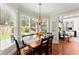 Charming dining area illuminated by a decorative chandelier and lots of natural light at 956 Kinghorn Nw Dr, Kennesaw, GA 30152