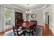 Elegant dining room featuring hardwood floors, a chandelier, and large windows offering lots of natural light at 956 Kinghorn Nw Dr, Kennesaw, GA 30152