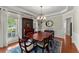 Elegant dining room with large windows, chandelier, and traditional furnishings at 956 Kinghorn Nw Dr, Kennesaw, GA 30152