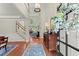 Grand foyer with hardwood floors, high ceilings, and elegant staircase at 956 Kinghorn Nw Dr, Kennesaw, GA 30152