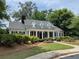 Charming home with classic Southern architecture, mature landscaping and a welcoming front porch at 956 Kinghorn Nw Dr, Kennesaw, GA 30152