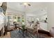 Comfortable living room with a fireplace and large windows offering ample natural light at 956 Kinghorn Nw Dr, Kennesaw, GA 30152