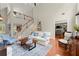 Bright living room with soaring ceilings, comfortable seating, and an open layout at 956 Kinghorn Nw Dr, Kennesaw, GA 30152