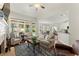 Inviting living room featuring a fireplace, neutral decor, and backyard views at 956 Kinghorn Nw Dr, Kennesaw, GA 30152