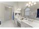 Elegant main bathroom featuring dual vanities, a soaking tub, and a separate shower at 956 Kinghorn Nw Dr, Kennesaw, GA 30152