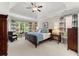 Spacious main bedroom with tray ceilings, large windows, and neutral décor at 956 Kinghorn Nw Dr, Kennesaw, GA 30152