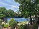 Well-maintained community tennis courts with lush landscaping and seating area at 956 Kinghorn Nw Dr, Kennesaw, GA 30152