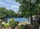 Well-maintained community tennis courts with lush landscaping and shaded gazebo area at 956 Kinghorn Nw Dr, Kennesaw, GA 30152