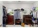 Organized walk-in closet with ample storage space for clothing and accessories at 956 Kinghorn Nw Dr, Kennesaw, GA 30152