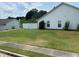 Wide backyard featuring a green lawn and a white fence, perfect for outdoor activities and relaxation at 2256 Hansford Pass, Buford, GA 30519