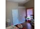Bedroom with window and sitting area with good light and wood flooring at 2256 Hansford Pass, Buford, GA 30519