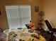 Bright bedroom with a window, hardwood floors, and a comfortable setting at 2256 Hansford Pass, Buford, GA 30519