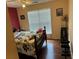 Comfortable bedroom with hardwood floors, natural light, and a dedicated workout area at 2256 Hansford Pass, Buford, GA 30519