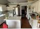 Bright kitchen with white cabinets, stainless steel appliances, and an island at 2256 Hansford Pass, Buford, GA 30519