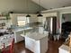 Bright kitchen with white cabinets, stainless steel appliances, and an island at 2256 Hansford Pass, Buford, GA 30519