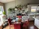 Bright eat-in kitchen featuring white cabinets, hardwood floors, and lots of natural light at 2256 Hansford Pass, Buford, GA 30519