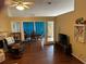 Large living room with hardwood floors, fireplace, and dining room at 2256 Hansford Pass, Buford, GA 30519