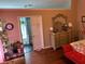 Spacious primary bedroom boasting hardwood floors, en suite bathroom, and ample natural light at 2256 Hansford Pass, Buford, GA 30519