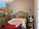 Comfortable primary bedroom featuring hardwood floors, decorative dresser, and a cozy bed at 2256 Hansford Pass, Buford, GA 30519