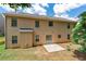 Exterior view of the home features a patio and large backyard with green grass at 3065 Moser Way, Marietta, GA 30060
