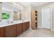 Bathroom features double sinks, wooden cabinets, and a large mirror at 3065 Moser Way, Marietta, GA 30060