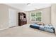 Spacious bedroom features plush carpet, a large window and a classic dresser at 3065 Moser Way, Marietta, GA 30060