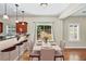 Dining room features hardwood floors, table set for four, and pendant lighting above at 3065 Moser Way, Marietta, GA 30060