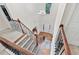 Open foyer with hardwood floors and staircase with decorative railing and a chandelier at 3065 Moser Way, Marietta, GA 30060