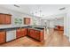 Well-lit kitchen featuring granite countertops and stainless steel dishwasher opens to a living room at 3065 Moser Way, Marietta, GA 30060