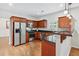 Well-equipped kitchen featuring granite countertops, stainless steel appliances, and wood cabinetry at 3065 Moser Way, Marietta, GA 30060