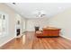 Living room boasts hardwood floors, fireplace, and a leather sofa with ample natural light at 3065 Moser Way, Marietta, GA 30060