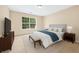 Well-lit main bedroom boasts a plush bed, soft carpet, and a serene atmosphere at 3065 Moser Way, Marietta, GA 30060