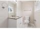 Bright bathroom features a granite vanity, tile floors, and an updated toilet at 3787 Stephanie Sw Dr, Atlanta, GA 30331