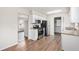 Bright kitchen featuring stainless steel appliances, granite countertops, and wood flooring at 3787 Stephanie Sw Dr, Atlanta, GA 30331