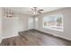 Inviting living room featuring wood floors, a ceiling fan, and plenty of natural light at 3787 Stephanie Sw Dr, Atlanta, GA 30331