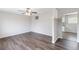 Bright living room featuring stylish wood floors and a modern ceiling fan at 3787 Stephanie Sw Dr, Atlanta, GA 30331